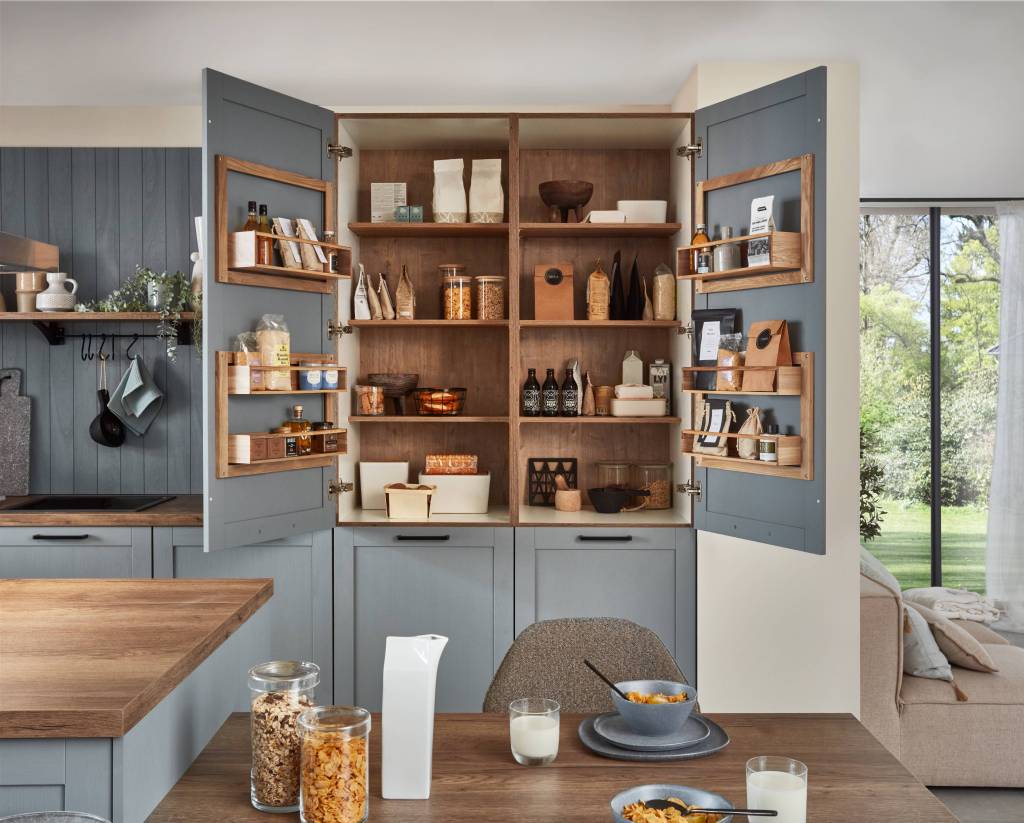 German kitchen storage solutions with pantry Storage by Quarry Interiors